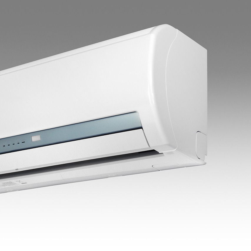 hvac technician repairing air conditioner